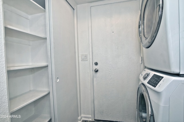 laundry room with stacked washer and dryer