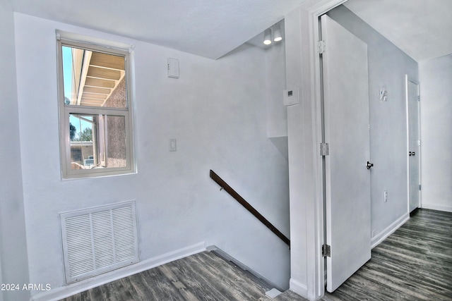 stairs with wood-type flooring