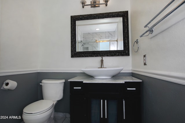 bathroom with tile patterned floors, vanity, and toilet