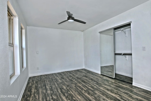 unfurnished bedroom with hardwood / wood-style floors, ceiling fan, and a closet