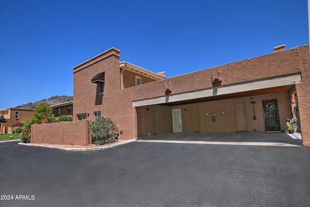 view of home's exterior featuring a carport