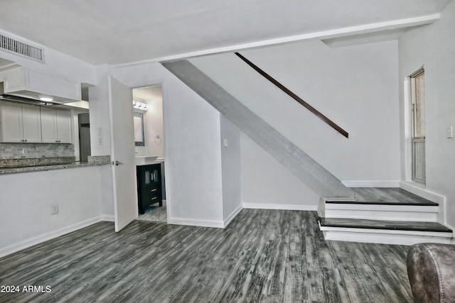 unfurnished living room featuring wood-type flooring