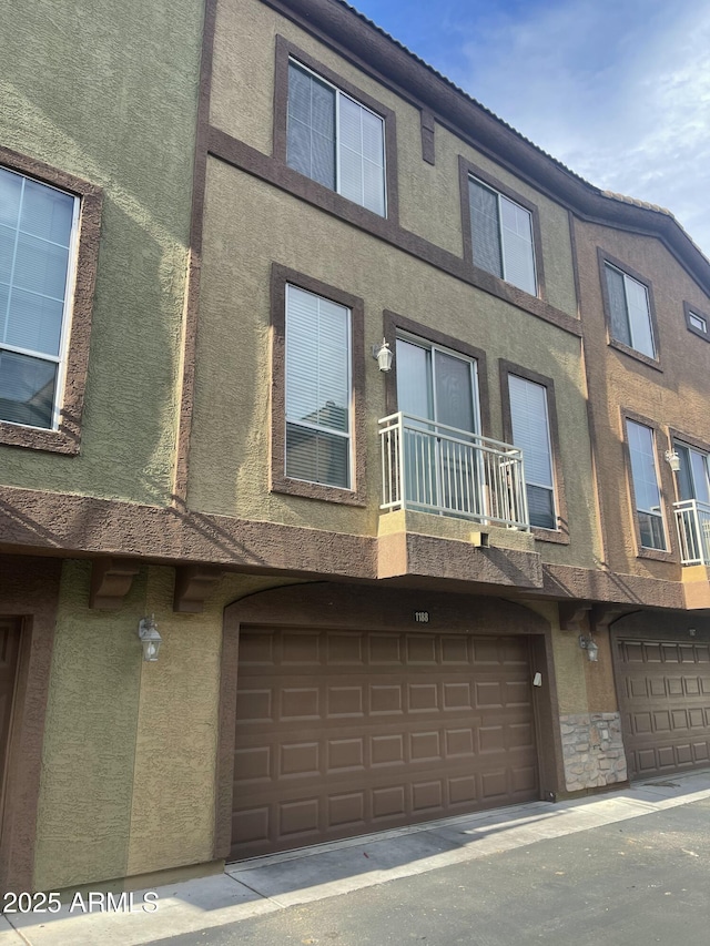 view of side of property featuring a garage