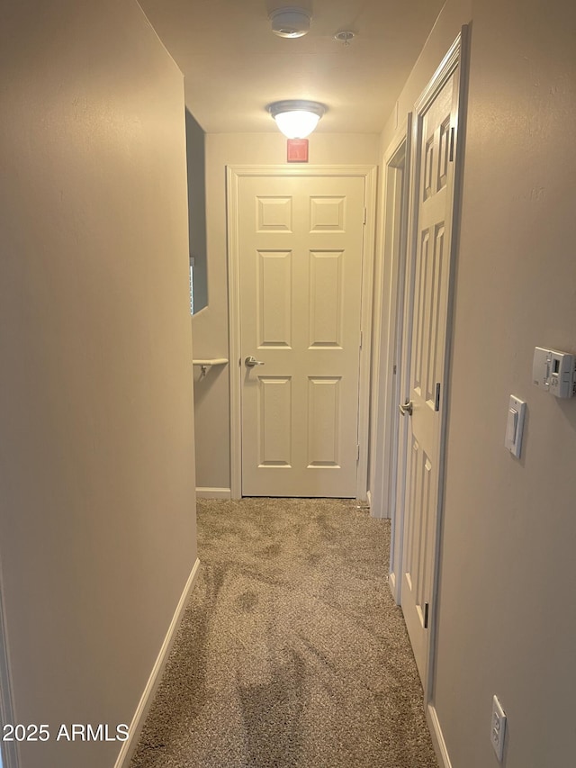 corridor featuring carpet flooring