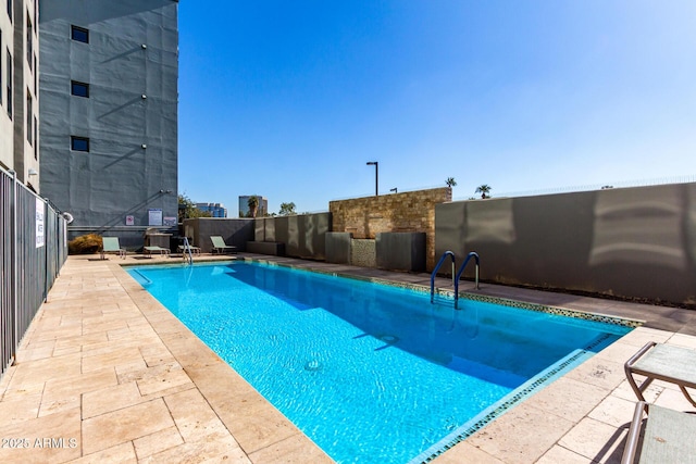 view of swimming pool featuring a patio