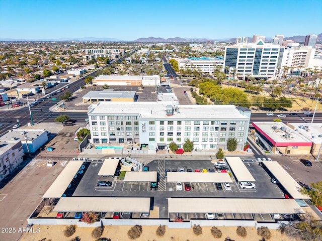 birds eye view of property featuring a mountain view