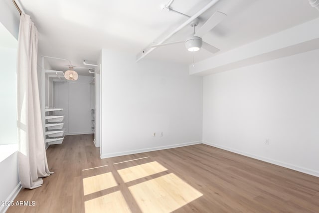 interior space featuring ceiling fan and light wood-type flooring