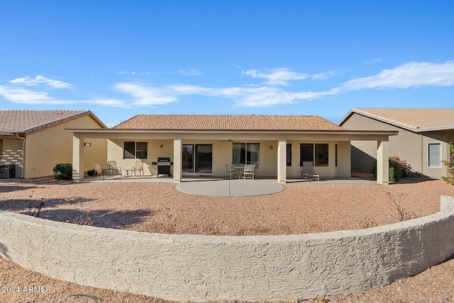 rear view of house featuring a patio area