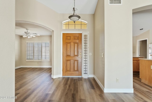 foyer with ceiling fan and light wood-type flooring