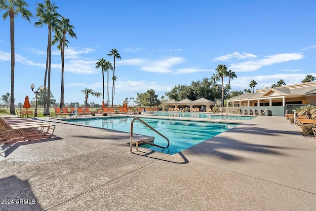 view of swimming pool with a patio area