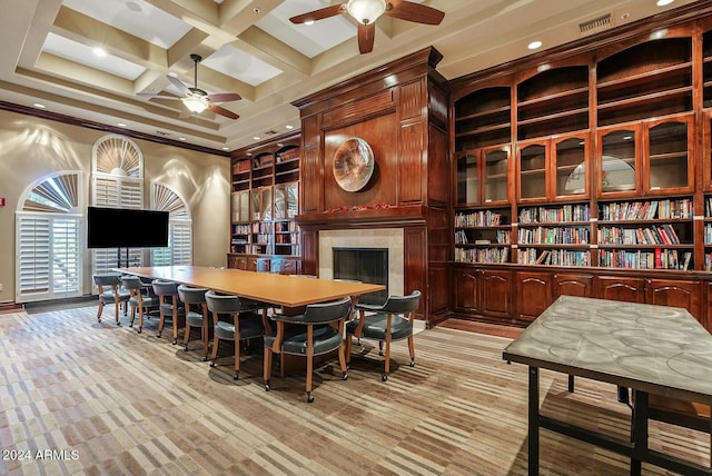 carpeted dining room featuring beam ceiling, ceiling fan, coffered ceiling, and a high ceiling