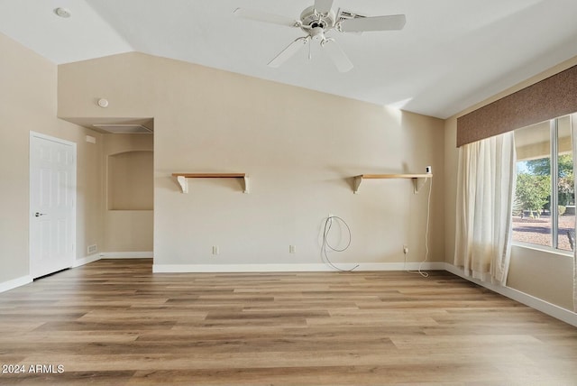 unfurnished living room with light hardwood / wood-style floors, ceiling fan, and lofted ceiling