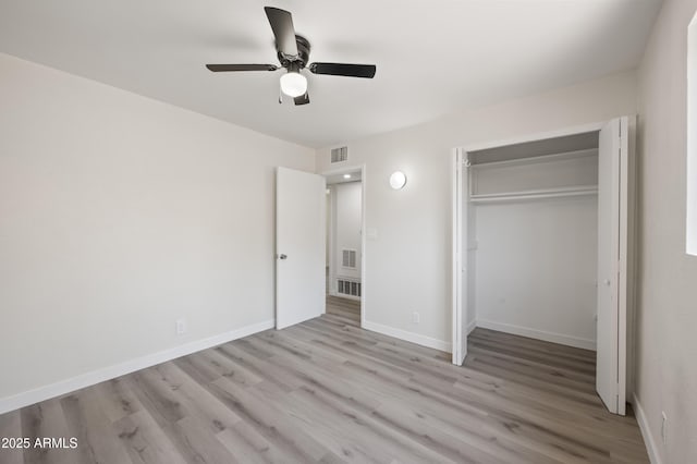 1427 W 6th Dr, Mesa, AZ 85202 - unfurnished bedroom featuring wood finished floors, a closet, and ceiling fan