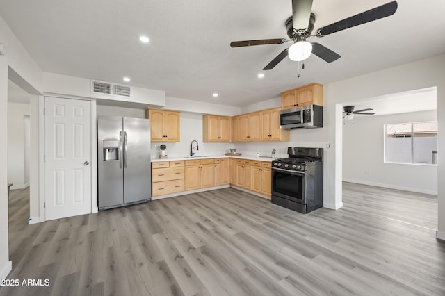 1427 W 6th Dr, Mesa, AZ 85202 - kitchen featuring appliances with stainless steel finishes, light brown cabinetry, recessed lighting, light countertops, and a ceiling fan