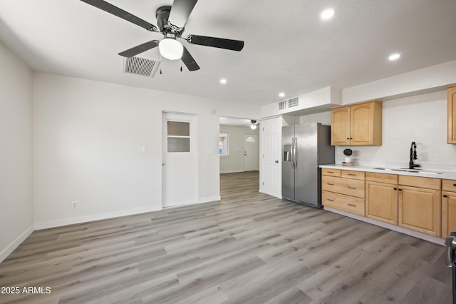 1427 W 6th Dr, Mesa, AZ 85202 - kitchen featuring stainless steel fridge, ceiling fan, recessed lighting, light wood-style flooring, and light countertops