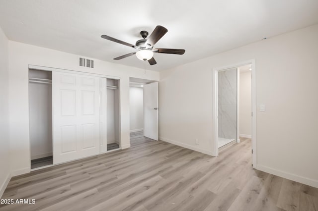 1427 W 6th Dr, Mesa, AZ 85202 - unfurnished bedroom featuring a closet, light wood-style flooring, and a ceiling fan