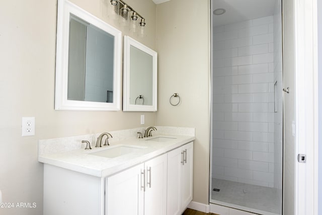 bathroom featuring vanity and tiled shower