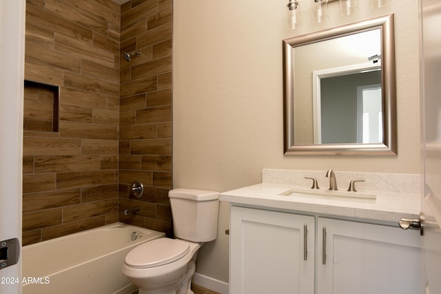 full bathroom featuring vanity, toilet, and tiled shower / bath combo