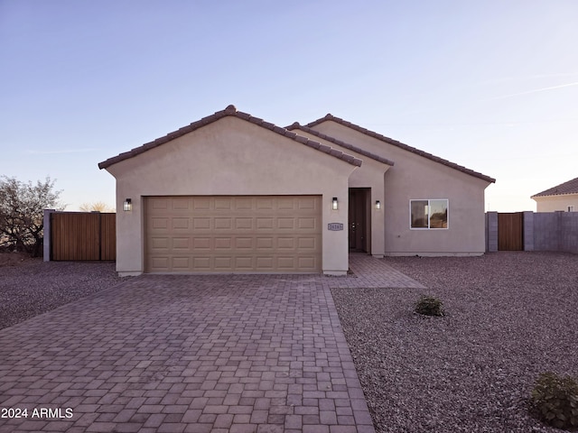 view of front of property with a garage