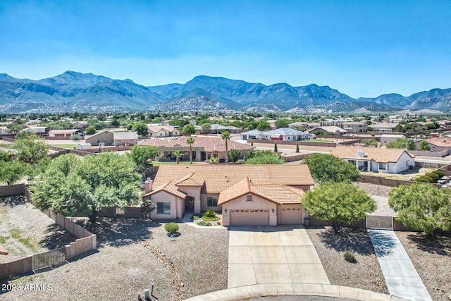 drone / aerial view featuring a mountain view and a residential view