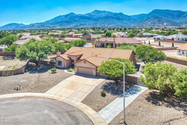 drone / aerial view featuring a residential view and a mountain view