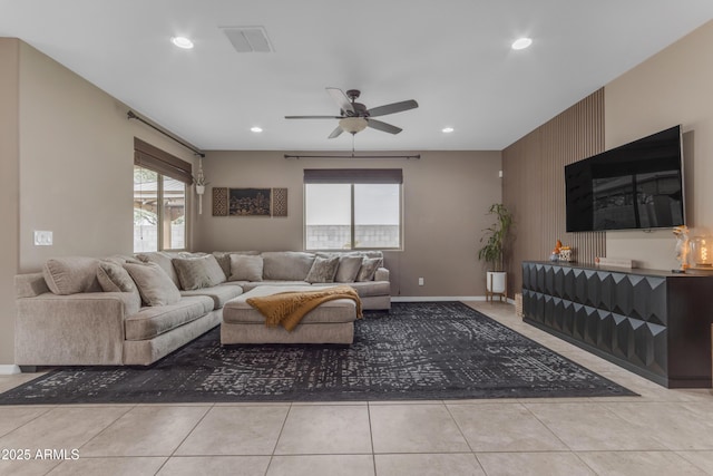 tiled living room with a ceiling fan, recessed lighting, and baseboards