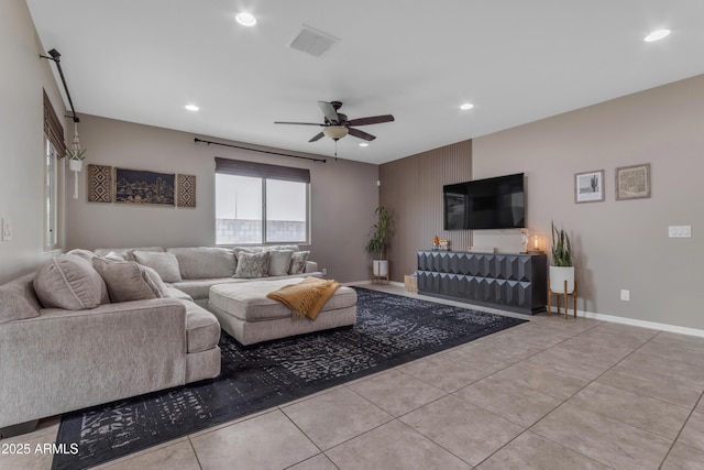tiled living room featuring ceiling fan and recessed lighting