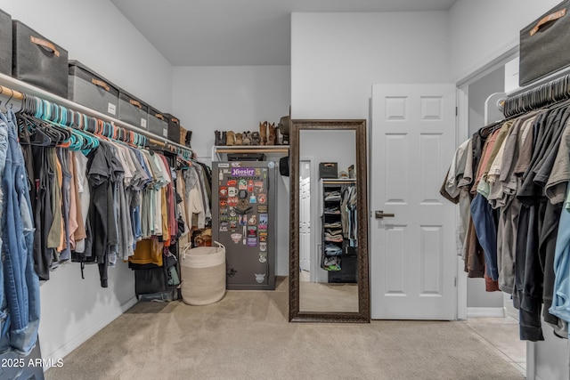 walk in closet featuring carpet floors