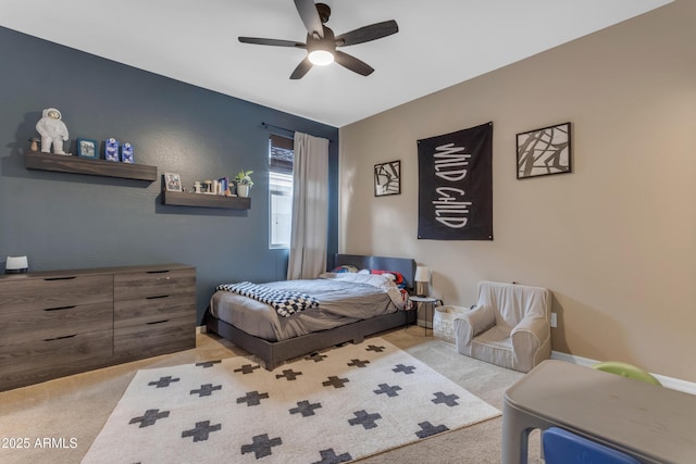 carpeted bedroom featuring ceiling fan