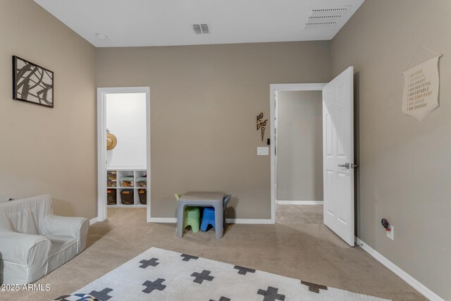 bedroom featuring carpet and baseboards