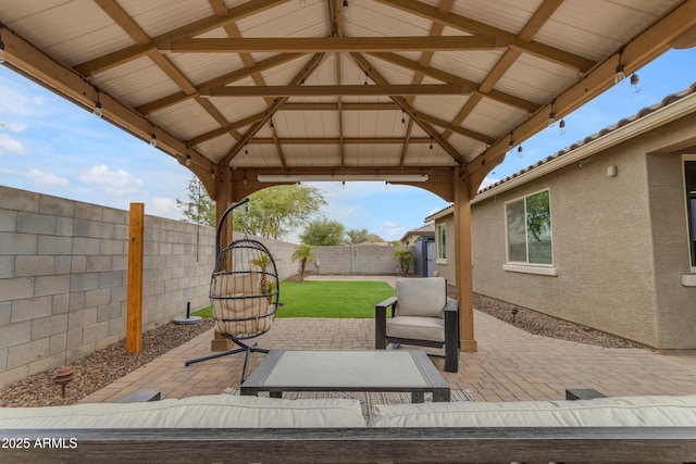 view of patio with a gazebo and a fenced backyard