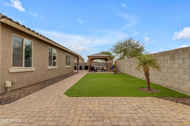 view of yard with a gazebo and a patio