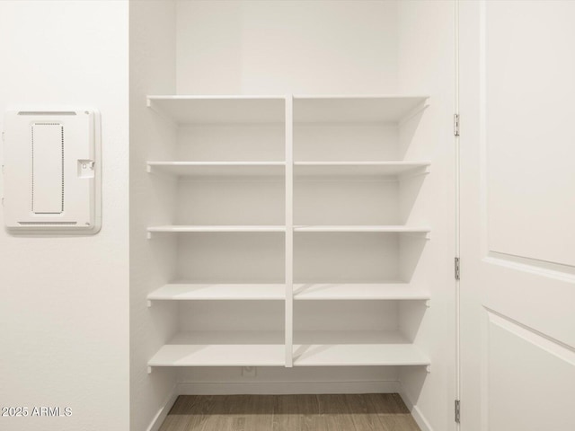 interior space with wood finished floors and baseboards