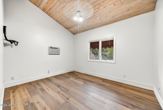 spare room with hardwood / wood-style floors, a wall mounted air conditioner, wood ceiling, and vaulted ceiling