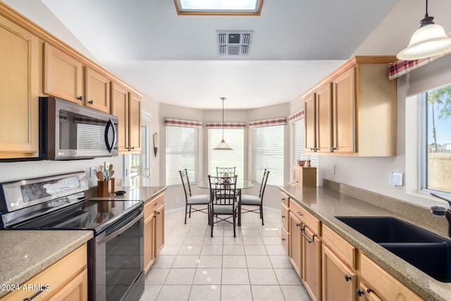 kitchen with light brown cabinetry, stainless steel appliances, sink, light tile patterned floors, and decorative light fixtures