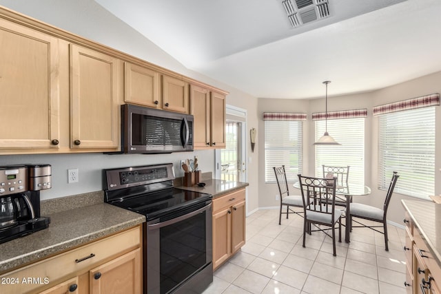 kitchen featuring vaulted ceiling, light tile patterned floors, light brown cabinetry, appliances with stainless steel finishes, and decorative light fixtures