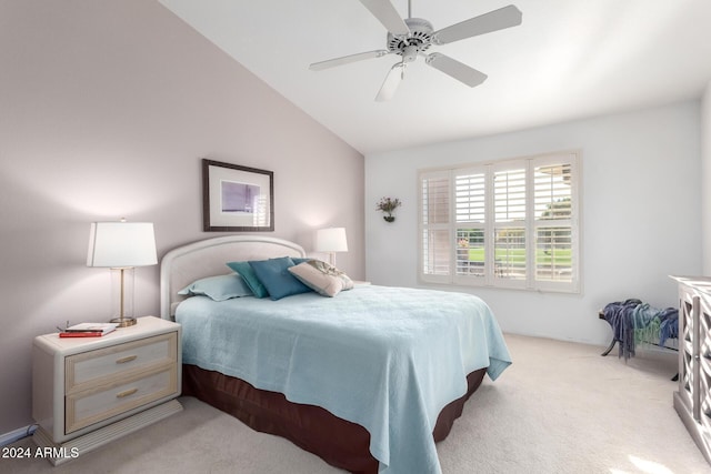 bedroom featuring ceiling fan, light carpet, and vaulted ceiling