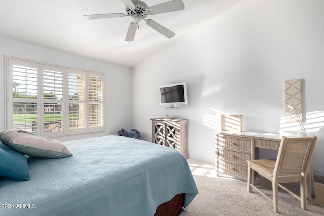 carpeted bedroom featuring ceiling fan and vaulted ceiling