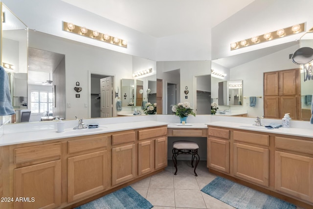 bathroom featuring tile patterned flooring, ceiling fan, lofted ceiling, and vanity