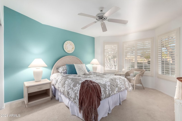 carpeted bedroom with ceiling fan