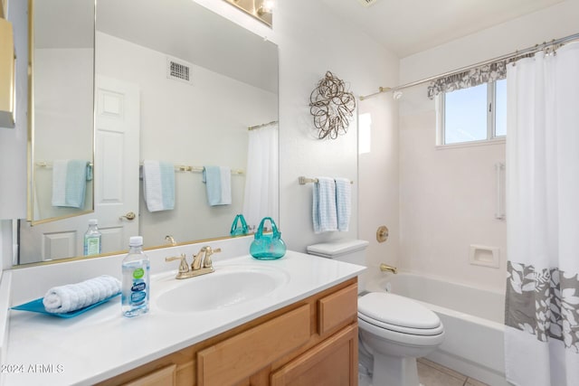 full bathroom featuring tile patterned flooring, shower / bath combination with curtain, vanity, and toilet