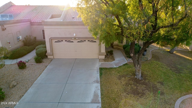 view of front of home with a garage and central AC unit