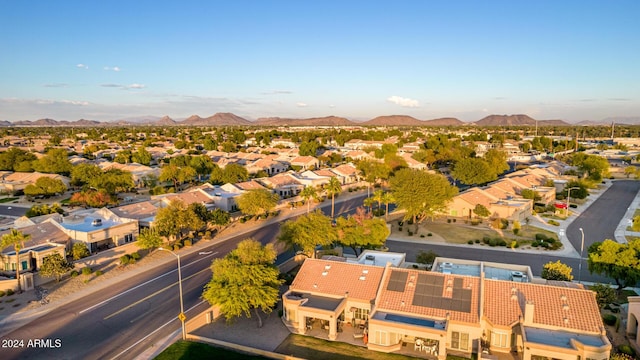 birds eye view of property with a mountain view