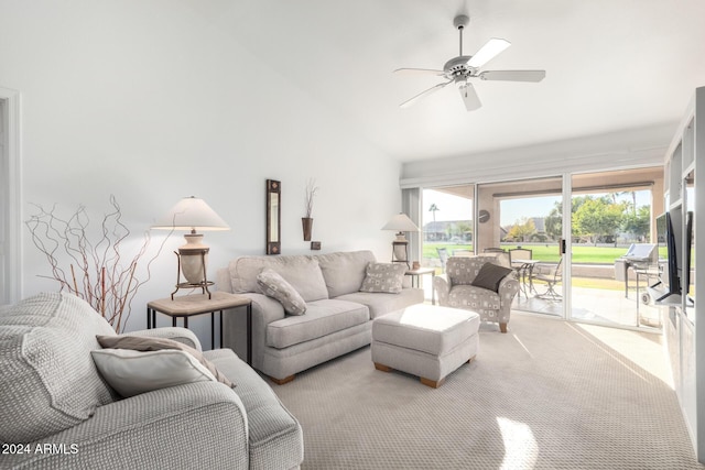 living room featuring ceiling fan and lofted ceiling