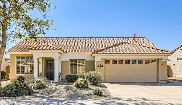 mediterranean / spanish house featuring a garage