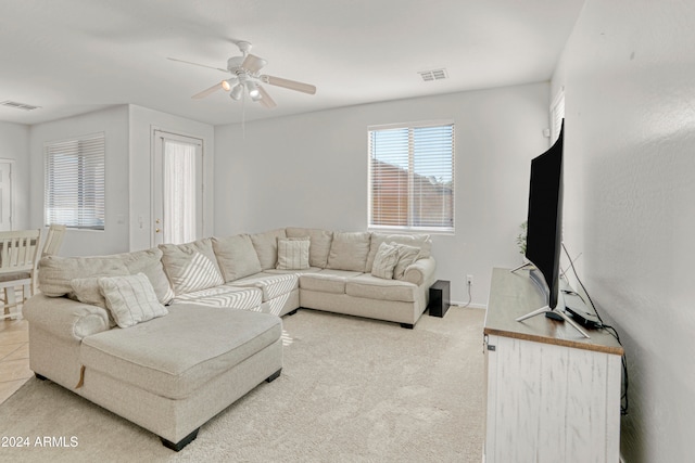 living room featuring ceiling fan and carpet floors