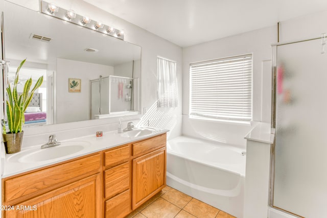 bathroom with shower with separate bathtub, tile patterned flooring, and vanity