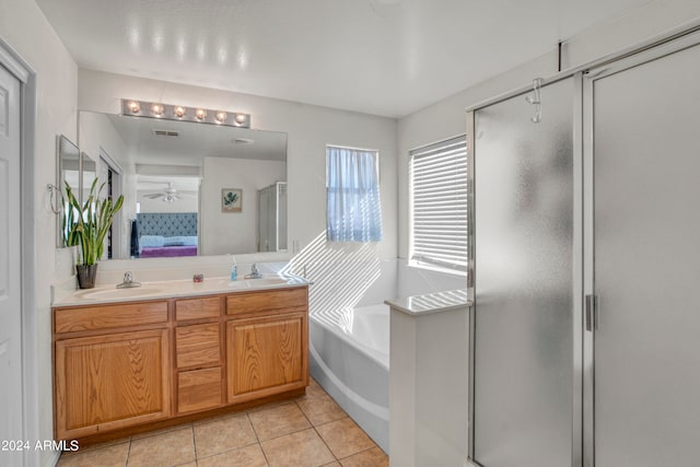 bathroom with ceiling fan, vanity, plus walk in shower, and tile patterned floors