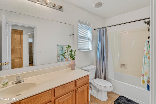 full bathroom with vanity, tile patterned floors, toilet, and shower / bath combo