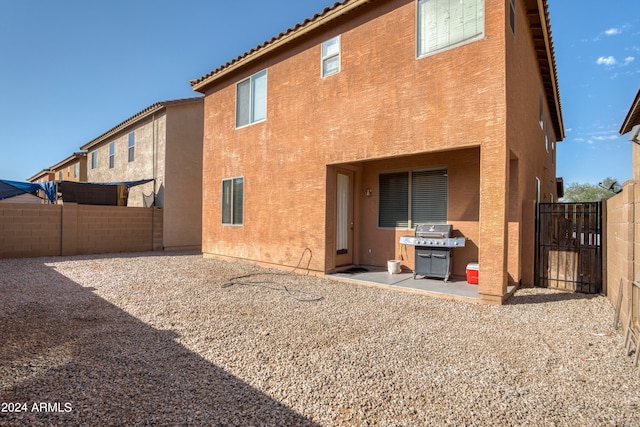 back of property featuring a patio